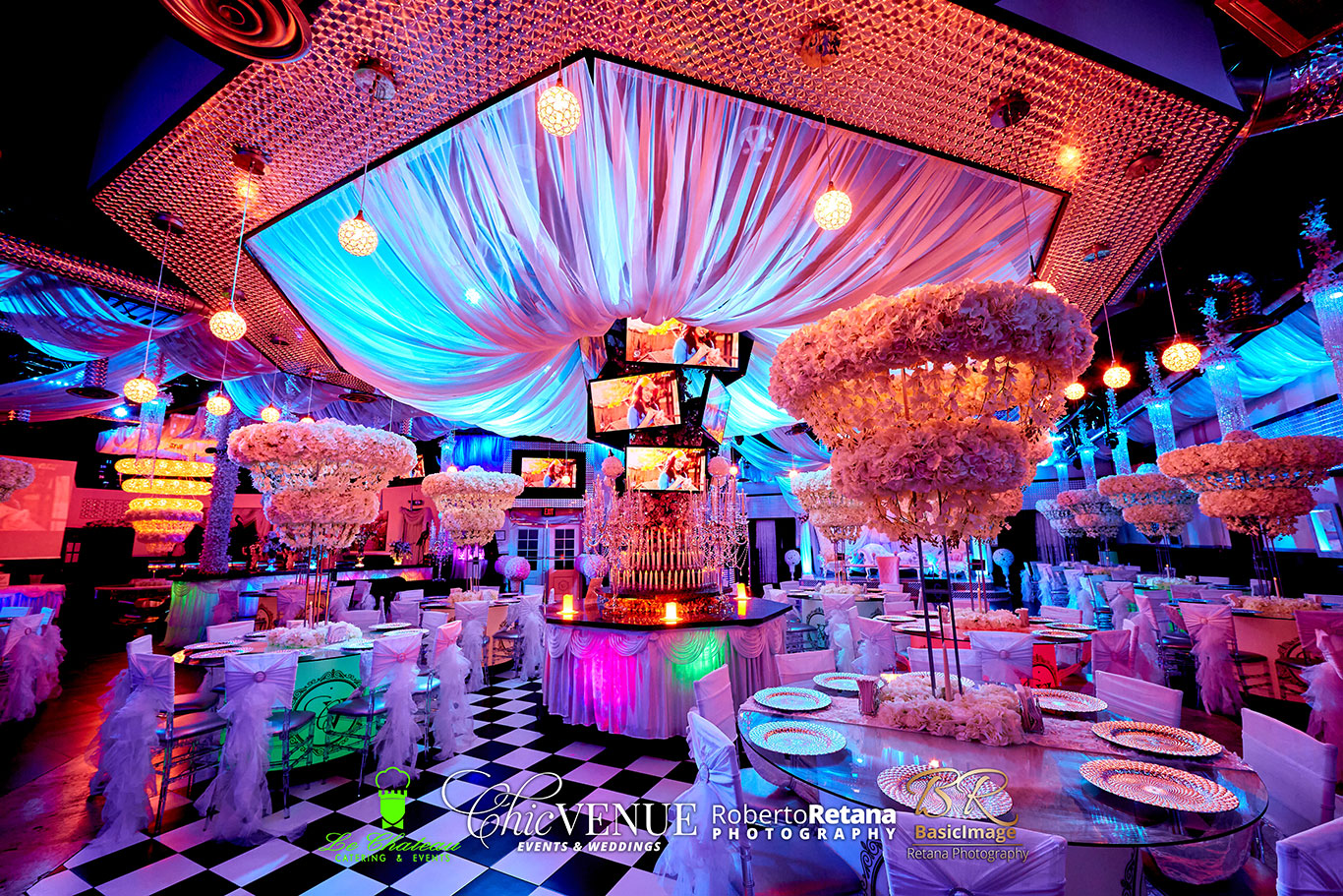 Spacious quinceañera dance floor beneath colorful lighting