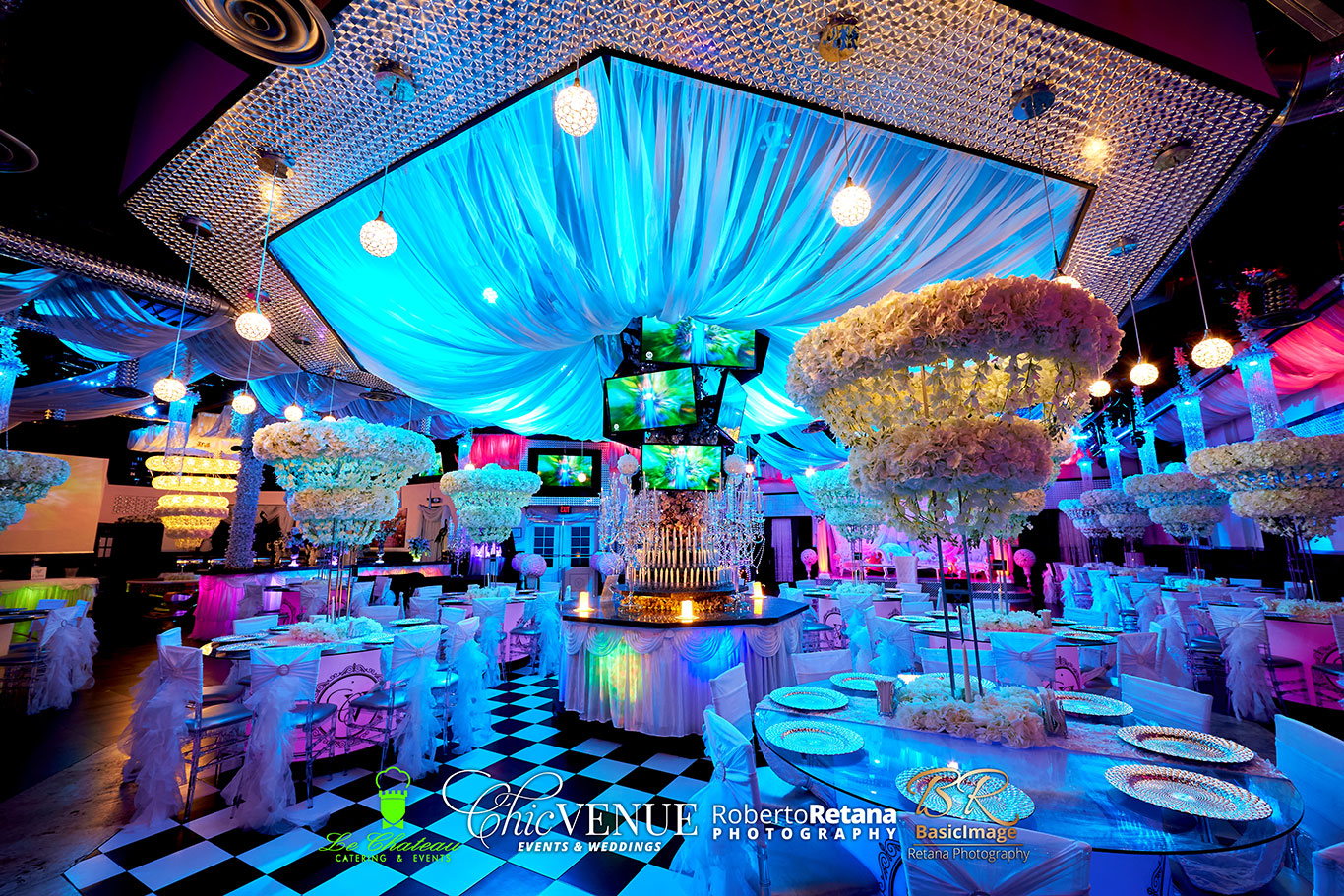 Birthday party dining setup beneath colorful venue lighting