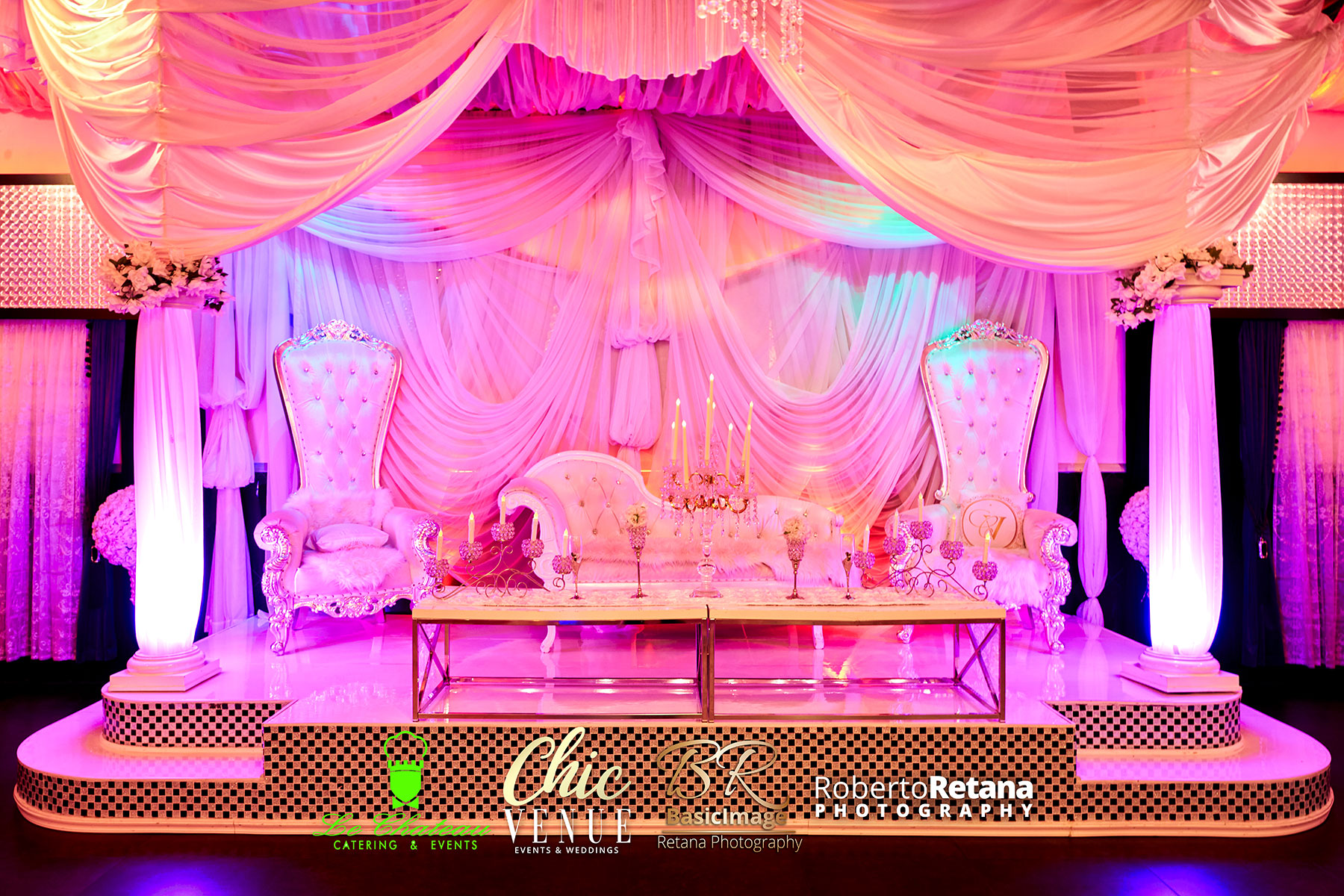 Furnished presentation stage with multiple screens and professional lighting